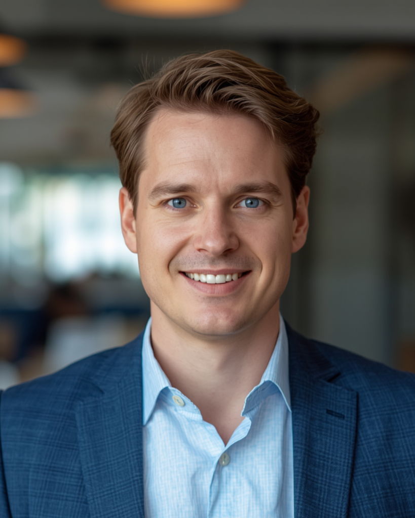 Smiling man in a blue blazer, representing AM Marketing Group's leadership and expertise in client growth and marketing strategy.