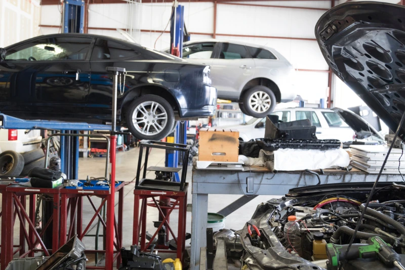 Auto repair shop owner working on a vehicle in Salt Lake City